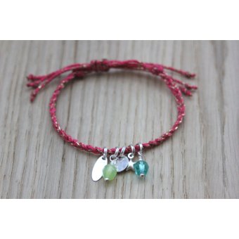 Bracelet tressé rose fuchsia et breloques argent