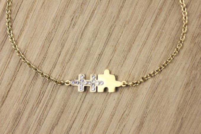 Bracelet puzzle en acier doré et zirconiums