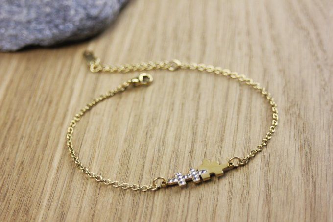 Bracelet puzzle en acier doré et zirconiums