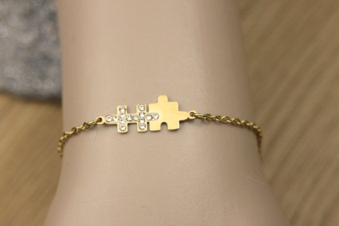 Bracelet puzzle en acier doré et zirconiums