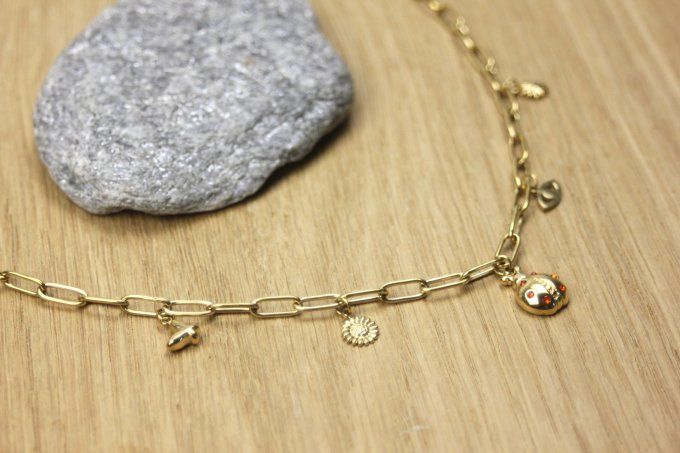 Collier en acier inoxydable doré gros maillons et breloques coccinelle