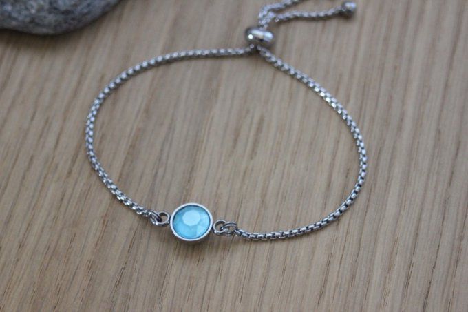 Bracelet acier cabochon rond en verre bleu fermoir perle stoppeur 