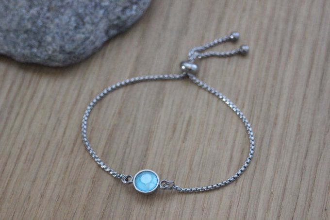 Bracelet acier cabochon rond en verre bleu fermoir perle stoppeur 