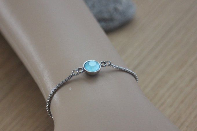 Bracelet acier cabochon rond en verre bleu fermoir perle stoppeur 