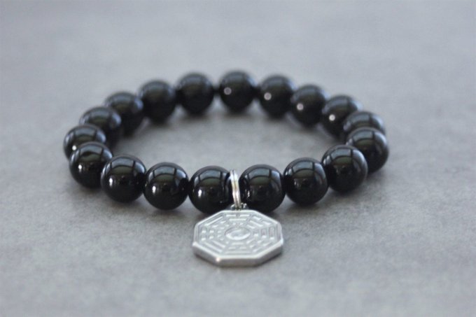 Bracelet perles onyx et breloque yin & yang en acier inoxydable