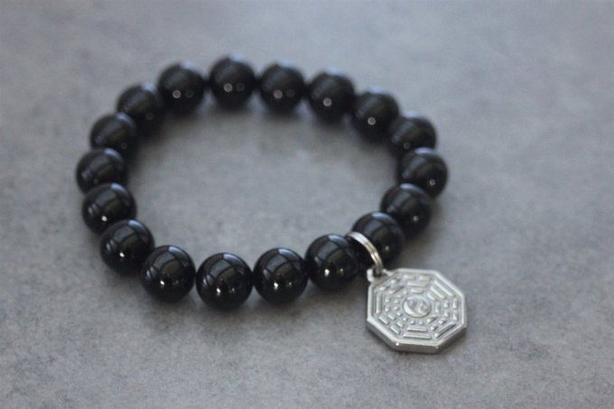 Bracelet perles onyx et breloque yin & yang en acier inoxydable