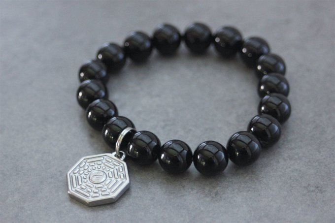 Bracelet perles onyx et breloque yin & yang en acier inoxydable