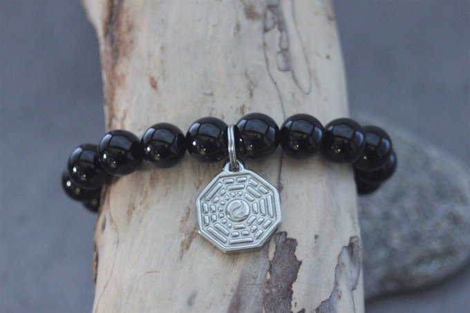Bracelet perles onyx et breloque yin & yang en acier inoxydable