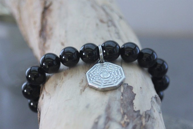 Bracelet perles onyx et breloque yin & yang en acier inoxydable