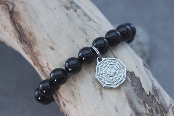 Bracelet perles onyx et breloque yin & yang en acier inoxydable